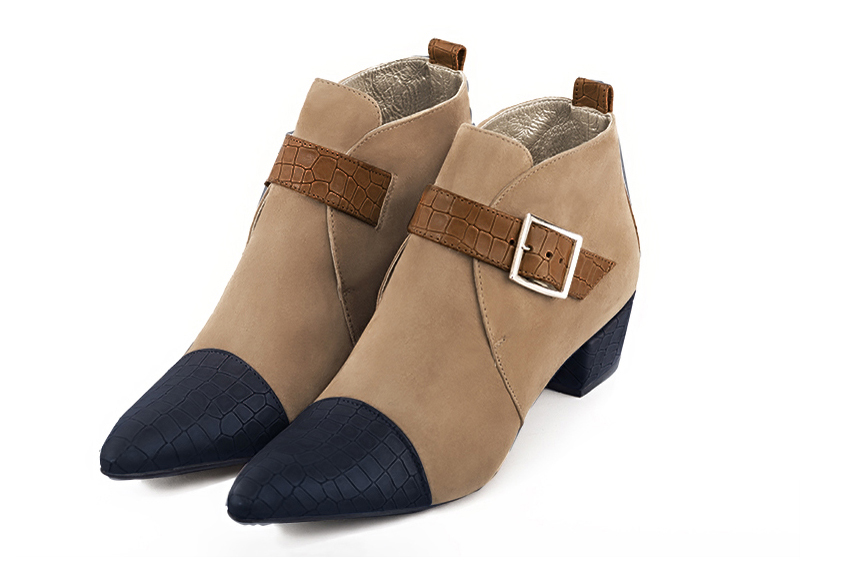 Women's navy blue, tan beige and caramel brown elegant ankle boots, with buckles at the front. Tapered toe. Low cone heels - Front view